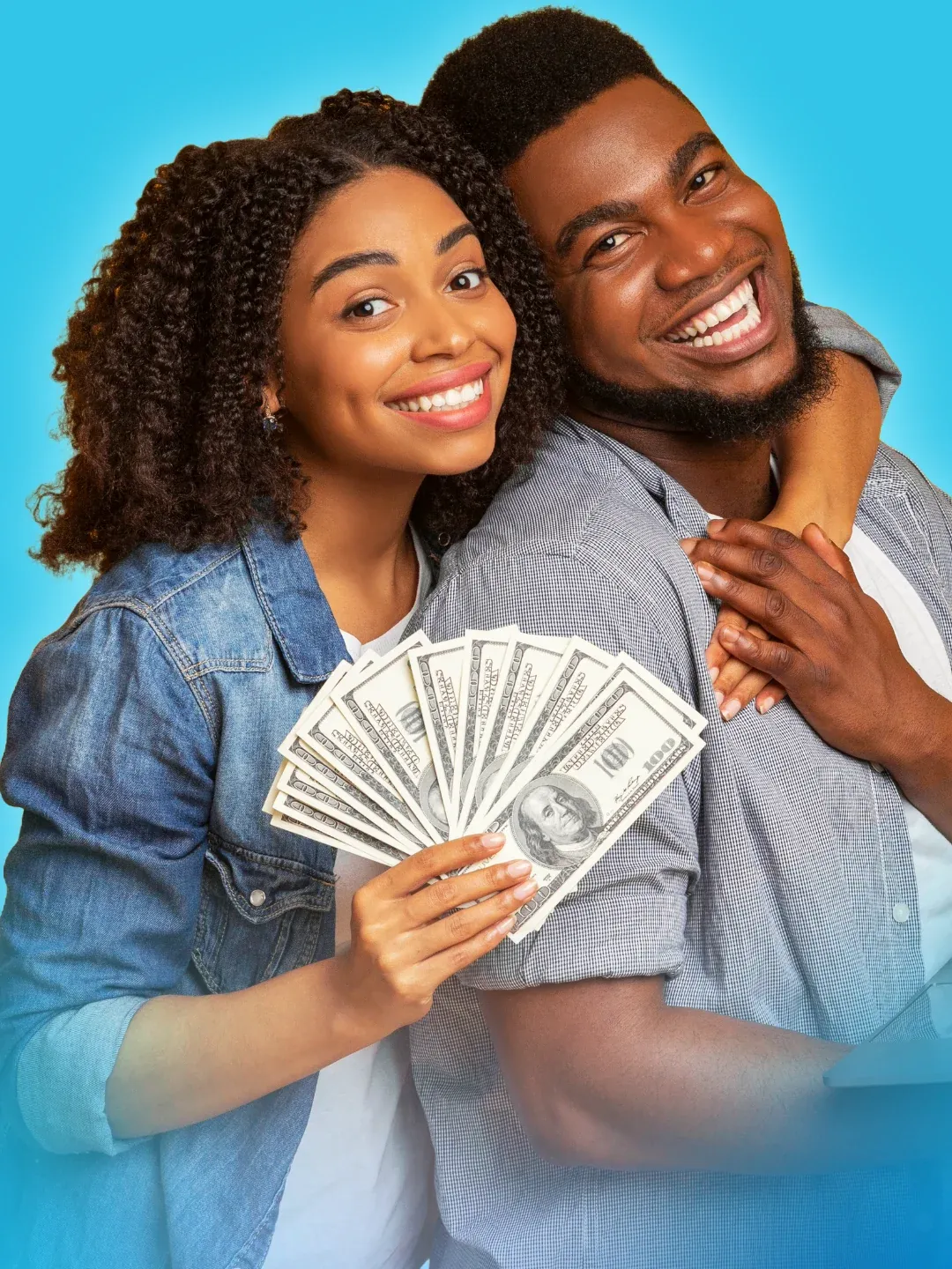 Smiling couple holding the cash from their loan