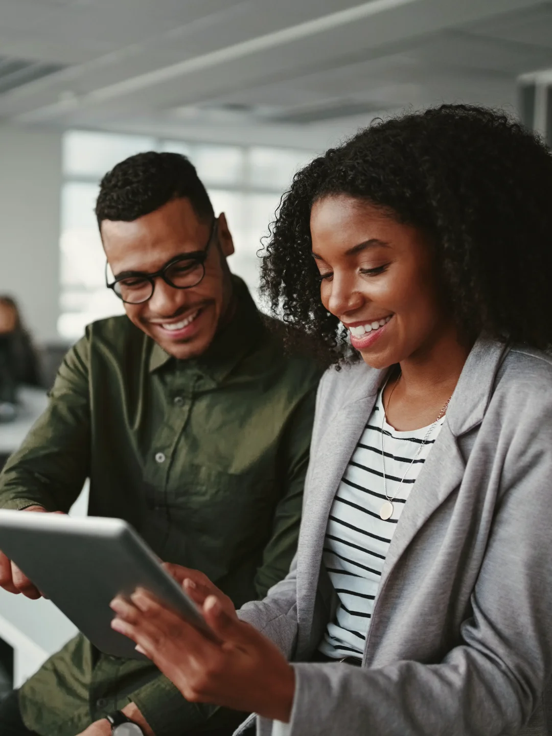 Couple reviewing their loan application together on a tablet